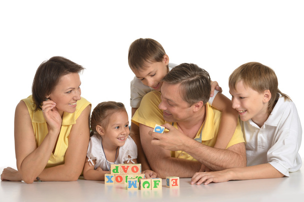 Family playing indoors - Фото, изображение
