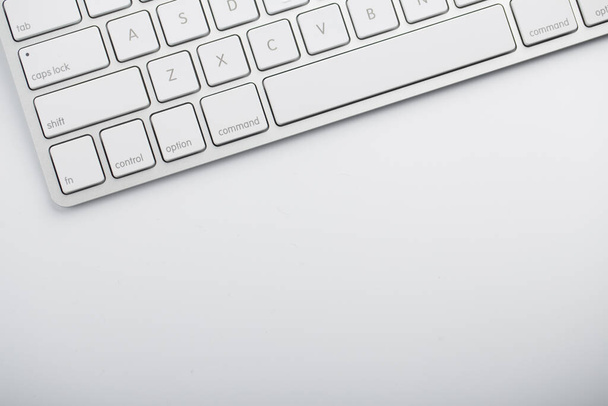 Closeup shot of white keyboard on white background. - Foto, immagini