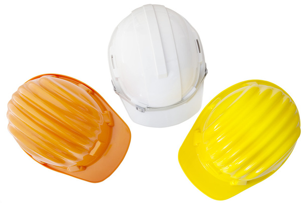 Vista superior de safetyt multicolor, construção, capacete de proteção
 - Foto, Imagem