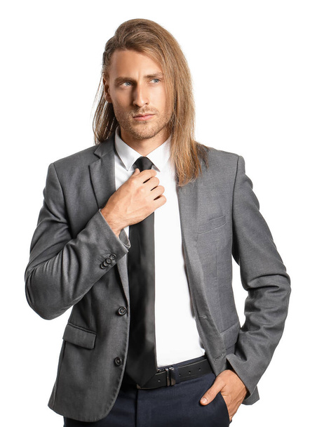 Handsome man with stylish hairdo on white background - Photo, Image