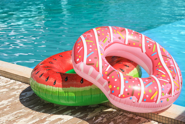Inflatable rings on the edge of swimming pool - Photo, Image