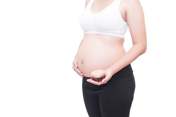 pregnancy with cream on white background - Foto, Imagem