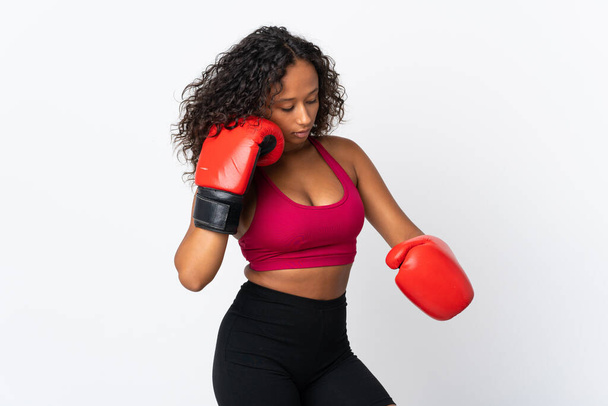 Teenager cuban girl isolated on white background with boxing gloves - Fotó, kép