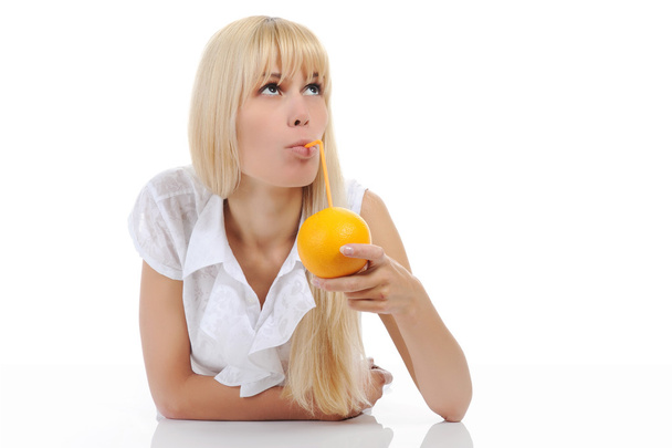 Blonde woman with orange drink - Foto, Bild