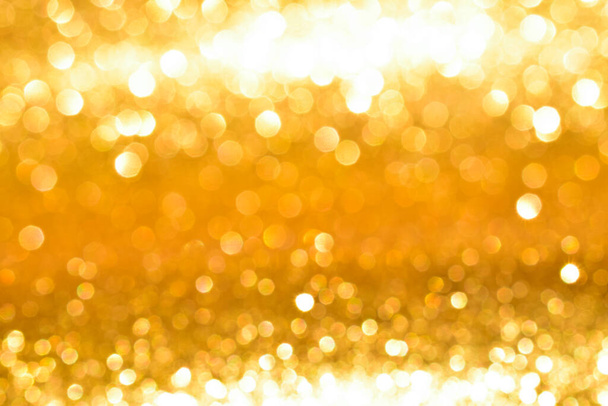 sparkles of golden glitter abstract background - Foto, imagen