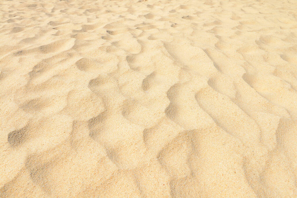 砂の質感。砂浜を背景に。トップ表示  - 写真・画像