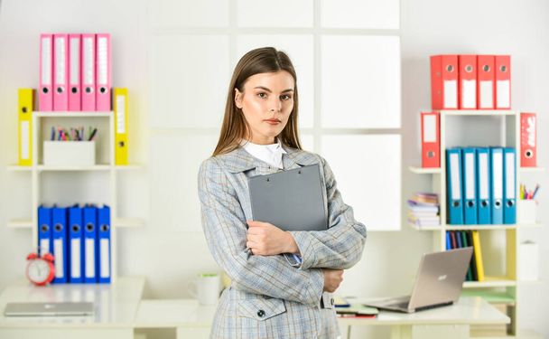 confident office worker. secretary with document folder. formal fashion style. woman with makeup. sexy girl in jacket ready for working day. successful woman work at workplace. Passionate about work - Photo, image