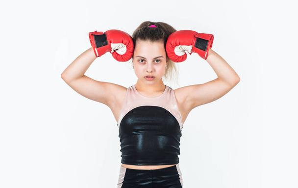 show her biceps. teen girl boxer. sportswear and equipment shop. healthy lifestyle. energetic kid power. child workout isolated on white. small girl training in boxing gloves. sport and fitness - Zdjęcie, obraz