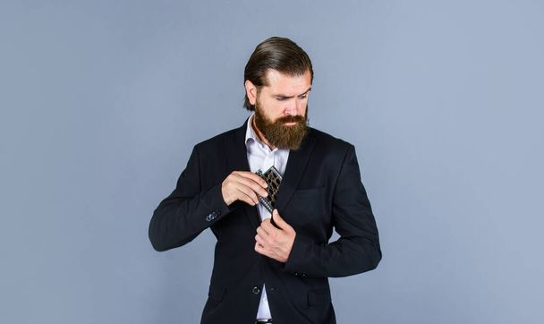 have to drink. Alcohol drink concept. Have alcohol drink with you. Always with me. Flat metal bottle for alcohol. man with elegant look. bearded hipster in suit hold metal flask for alcohol - Foto, immagini
