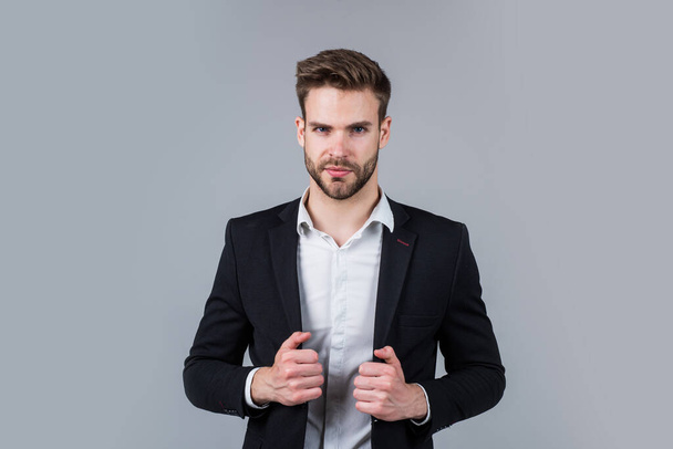 Seducing you. stylish realtor. handsome man wear formal suit. confident businessman in shirt and jacket. boss male. sexy ceo on gray background. modern office life. charismatic business owner - Foto, Imagen