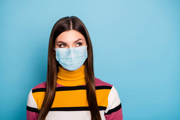 Close-up portrait of her she pretty pensive girl wearing safety gauze mask viral pneumonia disease influenza pandemia prevention contamination isolated over bright vivid blue color background - Photo, image
