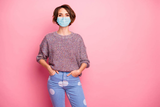 Portrait of her she nice pretty content healthy girl wearing safety gauze mask holding hands in pockets flue sickness illness disease preventive measures isolated over pink pastel color background - Foto, Imagem