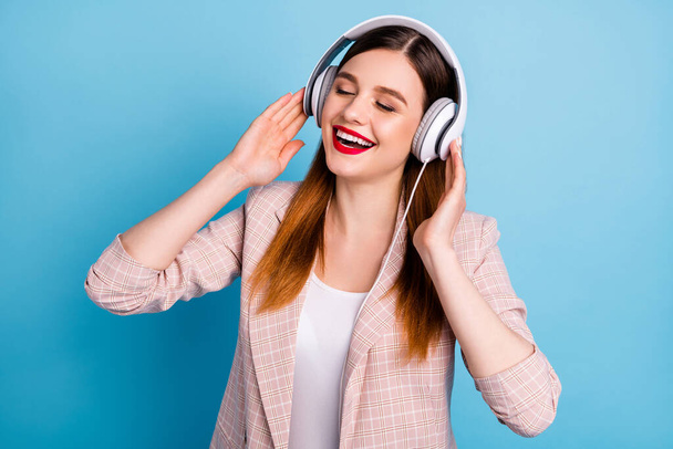 Portrait of candid content girl listen radio playlist have headset feel pleasure wear good look clothes isolated over blue color background - Foto, Bild