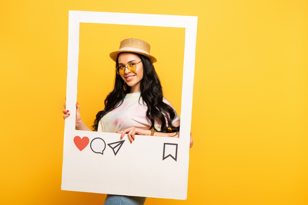 smiling brunette girl in summer outfit posing in social network frame on yellow background - Photo, Image