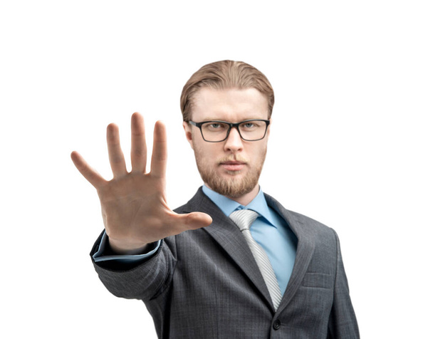 portrait one man businessman in glasses spectacles, showing gesture palm STOP or five fingers and look on camera, on white background, isolated - Photo, image