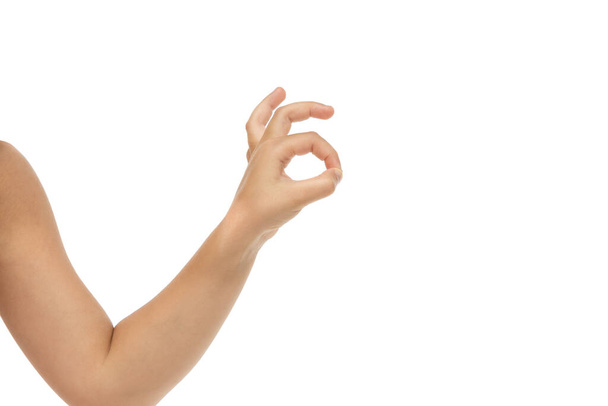 Childrens hand, palm gesturing isolated on white studio background - Foto, Imagen