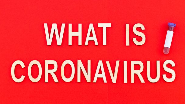 Coronavirus outbreak. Text in wooden letters on a red background - Foto, afbeelding