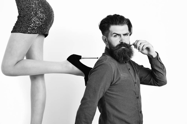 bearded man with sexy female legs has serious face - Foto, Imagem