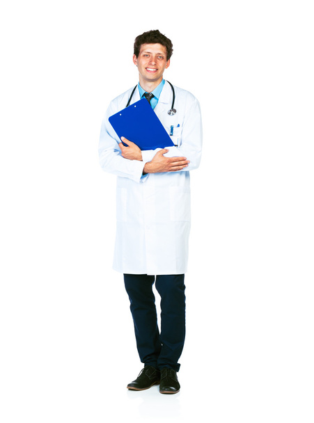 Full length portrait of a smiling male doctor holding a notepad - 写真・画像