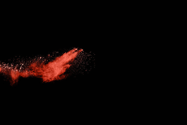 Living Coral  color powder explosion on black background. Colored cloud. Colorful dust explode. Paint Holi. - Fotó, kép