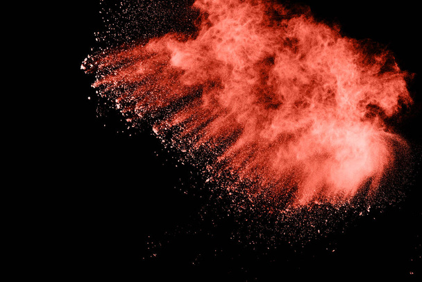 Living Coral  color powder explosion on black background. Colored cloud. Colorful dust explode. Paint Holi. - Foto, afbeelding
