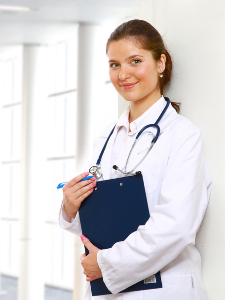 A portrait of a female doctor holding a folder - Foto, Imagen