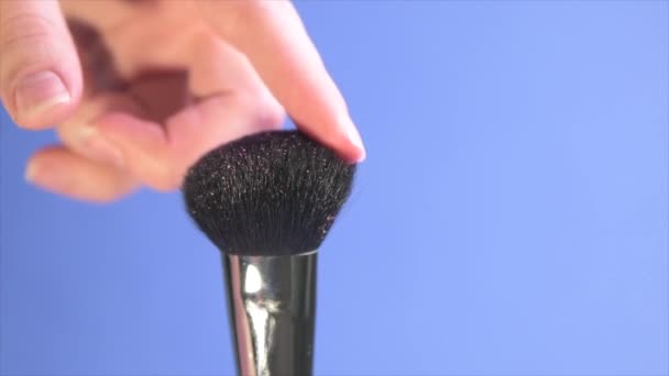 Close-up time lapse shot of a wide, fluffy cosmetic brush. - 映像、動画