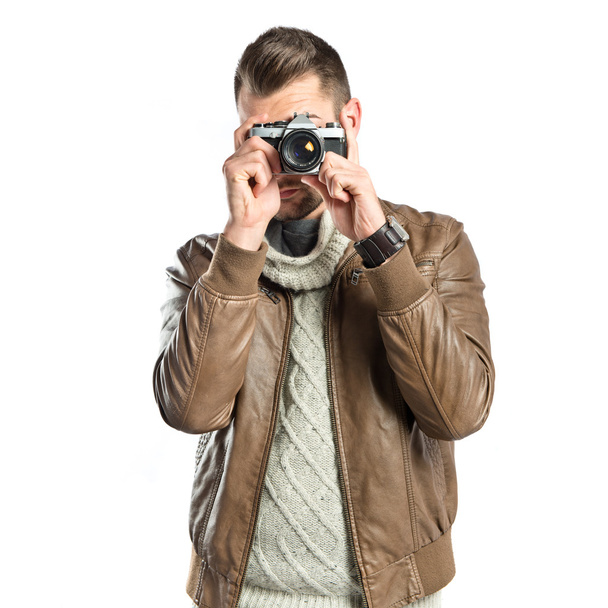 Hombre fotografiando a una chica sobre fondo blanco
 - Foto, Imagen