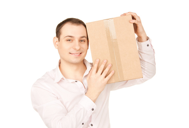 Businessman with parcel - Foto, afbeelding