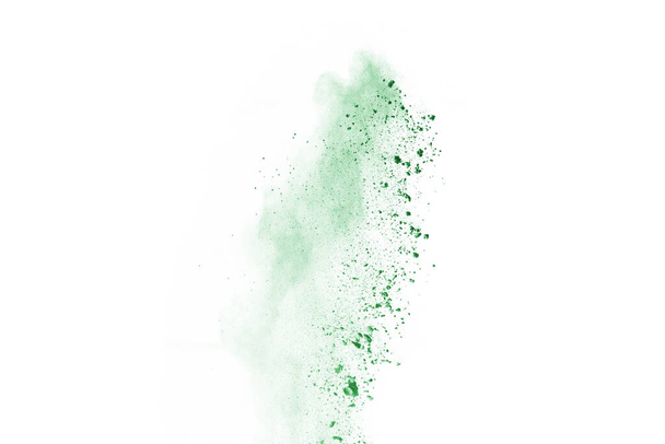Green powder explosion on white background. Colored cloud. Colorful dust explode. Paint Holi. - Foto, Bild