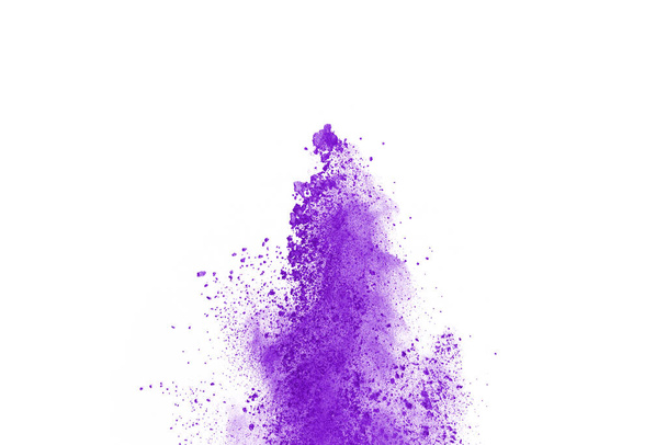 Powder explosion. Closeup of a purple dust particle explosion isolated on white. Abstract background. - Photo, Image