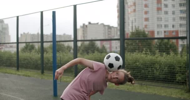 Girl practicing soccer skills and tricks - Video