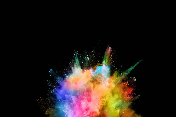 abstract colored dust explosion on a black background.abstract powder splatted background,Freeze motion of color powder exploding/throwing color powder, multicolored glitter texture. - Foto, Imagem