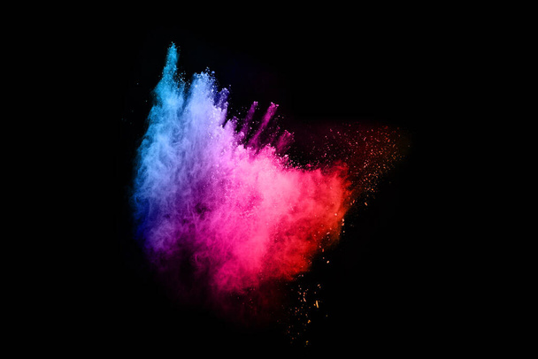 abstract colored dust explosion on a black background.abstract powder splatted background,Freeze motion of color powder exploding/throwing color powder, multicolored glitter texture. - Fotoğraf, Görsel