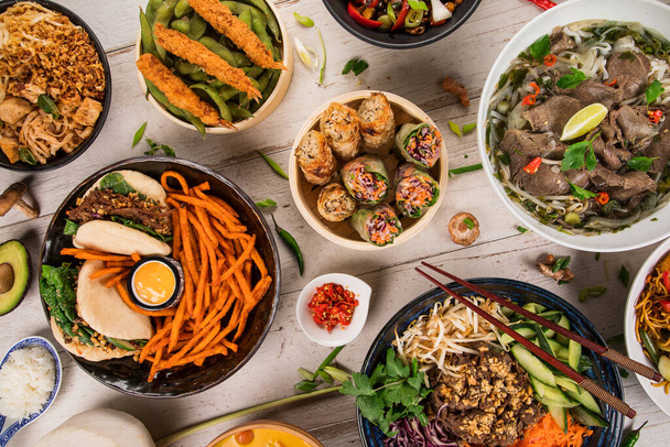 Asian food background with various ingredients on rustic wooden background , top view. - Фото, зображення