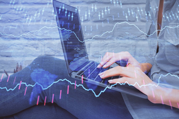 Multi exposure of woman hands typing on computer and forex chart hologram drawing. Stock market analysis concept. - Фото, изображение