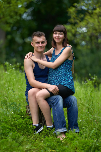 Happy young couple outdoor in the nature, having a great time - Foto, imagen