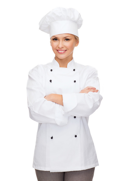 Smiling female chef with crossed arms - Foto, Imagem