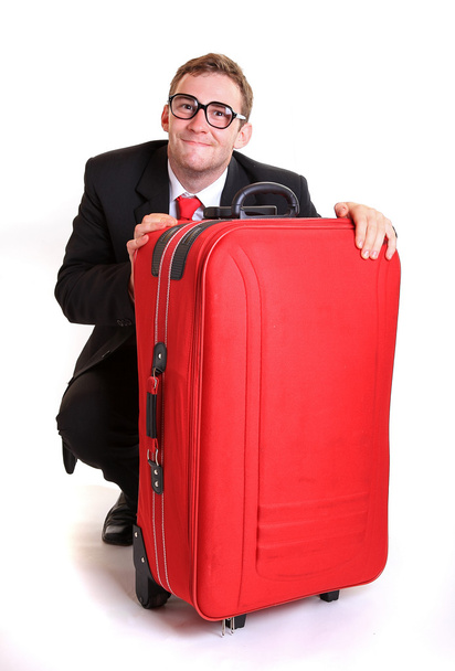 Молодий бізнесмен за червоним багажем
 - Фото, зображення