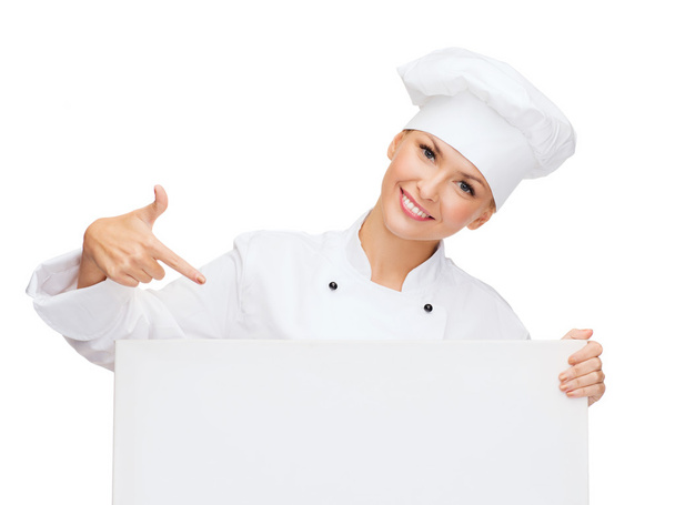 Smiling female chef with white blank board - Valokuva, kuva
