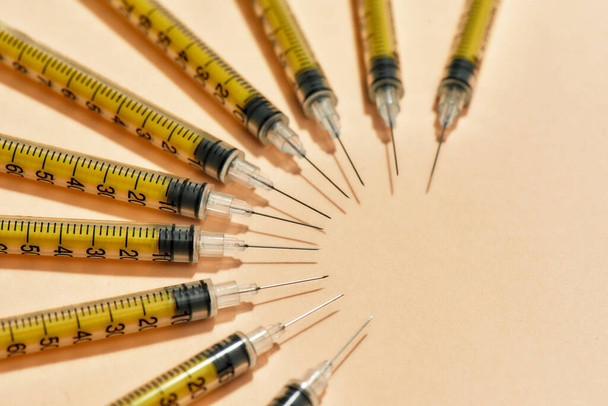 Medical syringes for injections lying isolated over light background. Injection medicine concept - 写真・画像