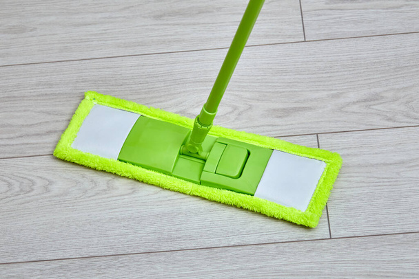 Close-up of mopping the floor. To wash the floor, laminate, parquet. - Fotografie, Obrázek