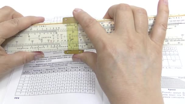 Make calculations on a logarithmic ruler. - Footage, Video