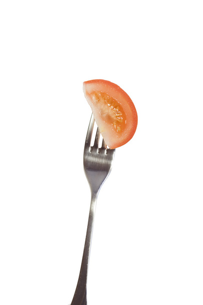 Tomato on fork isolated on white - Foto, immagini