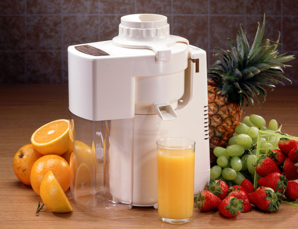 Juicer with glass and fruit - Photo, Image