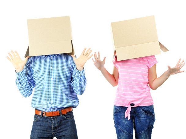 Couple with cardboard boxes on their heads isolated on white - Fotografie, Obrázek