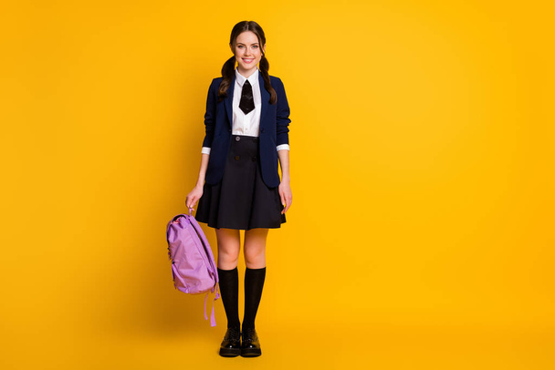 Full length body size view of nice attractive cheerful schoolgirl nerd holding in hand violet bag autumn fall season semester 1 September isolated on bright vivid shine vibrant yellow color background - Foto, Bild