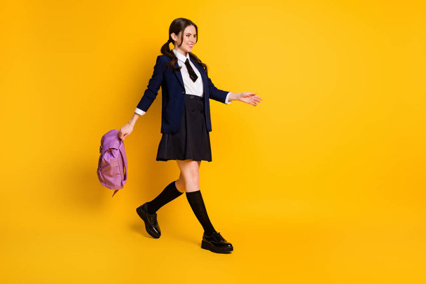 Full length body size view of her she nice attractive pretty cheerful cheery schoolgirl nerd going back to school carrying violet bag isolated bright vivid shine vibrant yellow color background - Foto, immagini