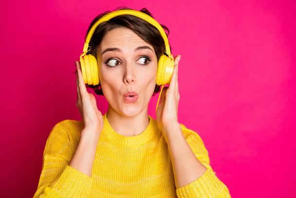 Portrait of astonished funny crazy girl have yellow headset listen unbelievable music impressed look copyspace wear jumper isolated over bright color background - Φωτογραφία, εικόνα