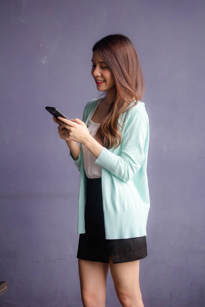 thai china adult office girl white shirt using her smart phone - Photo, Image
